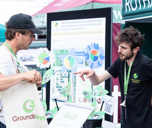 a scientist is talking to a member of the public